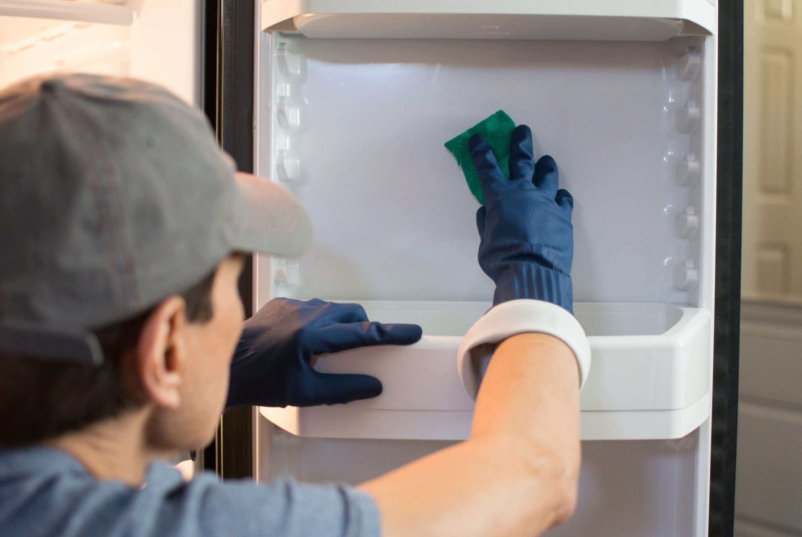 man-cleaning-the-fridge-2024-12-05-02-27-15-utc